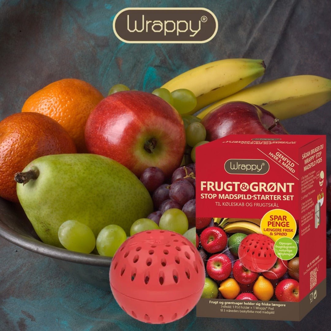 Wrappy® Pods Frisk & Sprø Startpakke med rød pod foran fruktfat med epler og druer