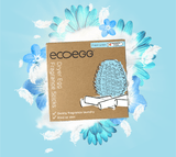 Ecoegg Refill for Tørkeegg, Fresh Linen, i pappemballasje, sett forfra med illustrasjon av tørkeegg og blomsterbakgrunn