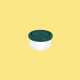 Pulito Pure Dip Box 50 ml med mørkegrønn lokk i rustfritt stål, sett fra siden på gul bakgrunn