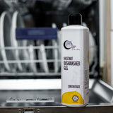Terra Gaia Oppvaskmaskin Gel 500ml Sitrus i plastflaske, plassert foran en åpen oppvaskmaskin