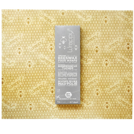 Wrappy Bivokspapir DIY 50x60 cm i beige med bikubemønster og grå emballasje, sett ovenfra