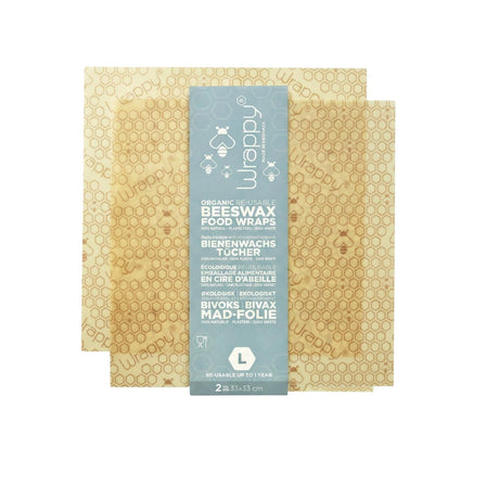 Wrappy Bivokspapir Large 2 stk i beige med bikubemønster, sett ovenfra med emballasje i midten